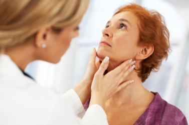 A doctor checks her patients throat. A doctor checks her patients throat.