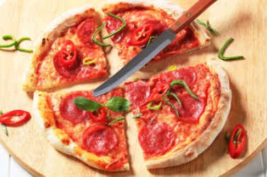 A quartered pizza. A quartered pizza.