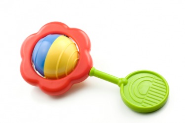 A child's toy rattle makes a rattling sound. A child's toy rattle makes a rattling sound.