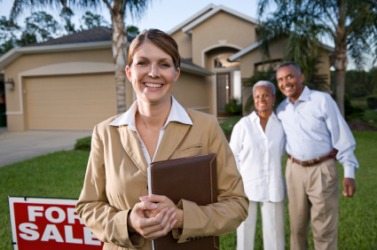 A Realtor with her clients. A Realtor with her clients.