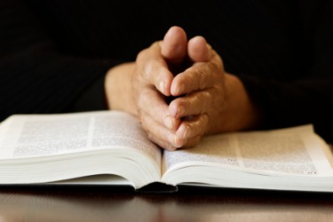 A religious person praying. A religious person praying.