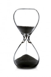 Sand running through a sandglass. Sand running through a sandglass.