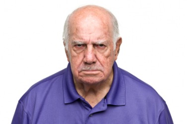A scowling man. A scowling man.
