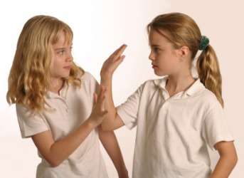 Two girls having a scuffle. Two girls having a scuffle.