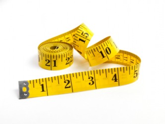 A rolled up tape measure. A rolled up tape measure.