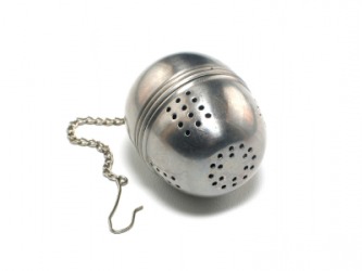 A tea ball is used to brew loose tea. A tea ball is used to brew loose tea.