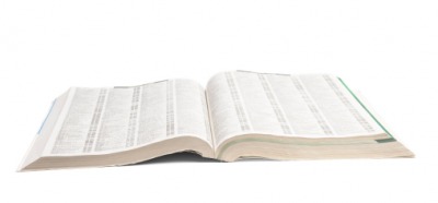 An open telephone book. An open telephone book.
