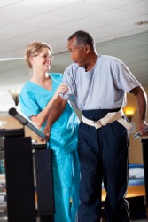A man receives physical therapy. A man receives physical therapy.