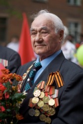 A veteran displays his medals. A veteran displays his medals.