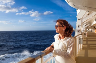 A woman enjoys her ocean voyage. A woman enjoys her ocean voyage.