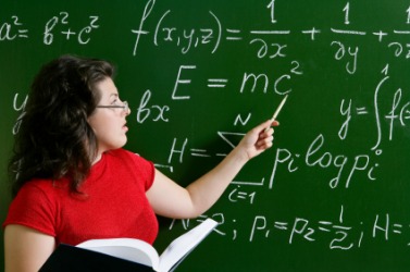 A woman teaching math. A woman teaching math.