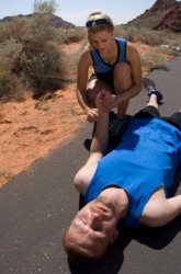 A woman assists an unconscious man. A woman assists an unconscious man.