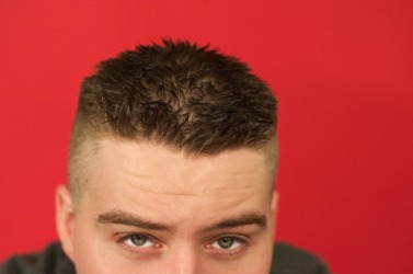 This man's hair is en brosse. This man's hair is en brosse.