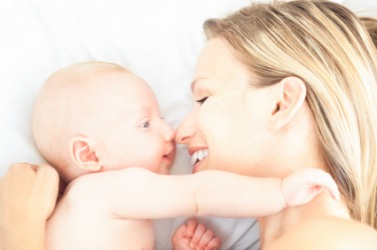 A mother gazes with love at her child. A mother gazes with love at her child.