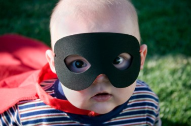 A cute baby wearing a mask. A cute baby wearing a mask.