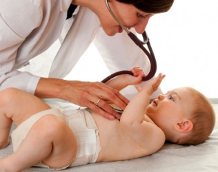 A baby being examined by a pediatrician. A baby being examined by a pediatrician.