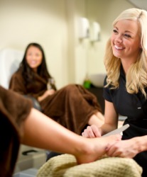 A woman gets a pedicure. A woman gets a pedicure.