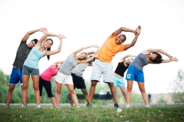 A group of people engaged in an exercise regimen. A group of people engaged in an exercise regimen.