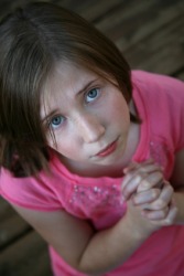 A little girl looking up beseechingly. A little girl looking up beseechingly.
