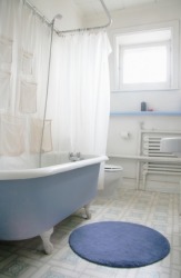 A round blue bathroom mat. A round blue bathroom mat.