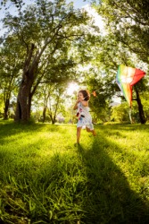 A little girl playing out in her yard. A little girl playing out in her yard.