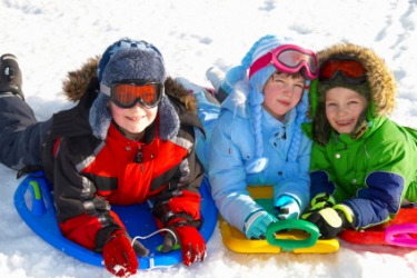 Children wearing outfits appropriate for playing in the snow. Children wearing outfits appropriate for playing in the snow.