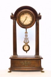 A pendulum in an old fashioned clock. A pendulum in an old fashioned clock.