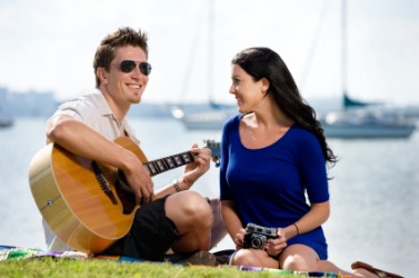 A man serenades his girlfriend. A man serenades his girlfriend.