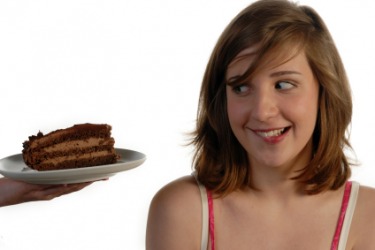 She finds this cake very tempting. She finds this cake very tempting.