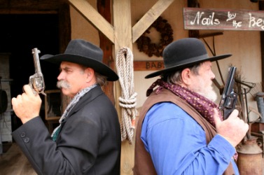 Two men face off for a duel. Two men face off for a duel.