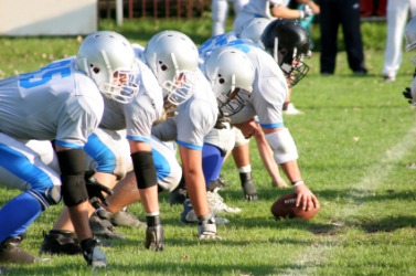 Players in an American football game. Players in an American football game.