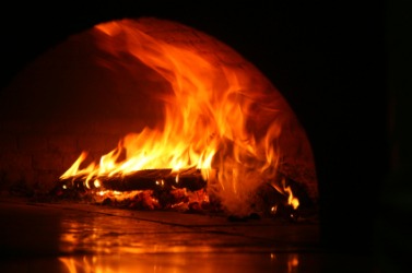 An inferno blazes within an oven. An inferno blazes within an oven.