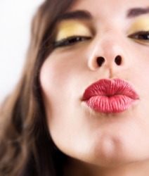 A pair of puckered lips. A pair of puckered lips.