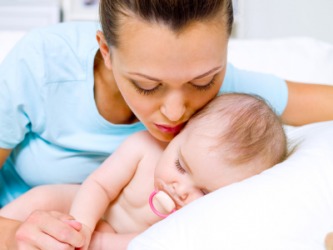 A mother showing affection for her baby. A mother showing affection for her baby.
