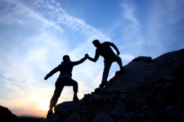 Helping a fellow climbing up the rock is a kindness. Helping a fellow climbing up the rock is a kindness.