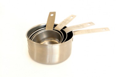 A set of metal measuring cups. A set of metal measuring cups.