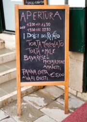 A menu outside of an Italian restaurant. A menu outside of an Italian restaurant.