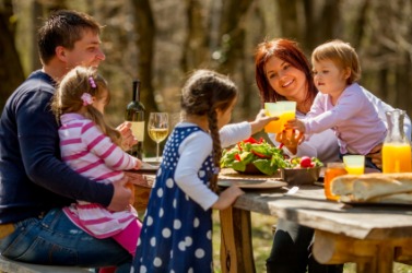 A family enjoying a picnic. A family enjoying a picnic.