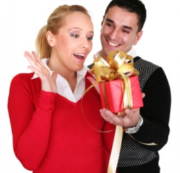A woman receives a gift. A woman receives a gift.