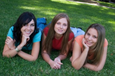 There are three girls in this photo. There are three girls in this photo.