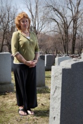 A widow visits her husbands grave. A widow visits her husbands grave.