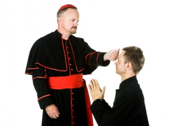 A bishop gives a blessing. A bishop gives a blessing.
