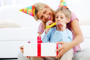 This little boy is about to get a birthday present. This little boy is about to get a birthday present.