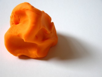 A lump of orange clay. A lump of orange clay.