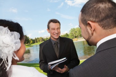 A minister performing a wedding ceremony. A minister performing a wedding ceremony.