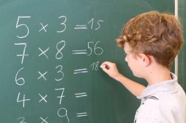 A student finds the solution to these problems. A student finds the solution to these problems.