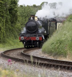 Calling this train a choo choo is an example of onomatopoeia. Calling this train a choo choo is an example of onomatopoeia.