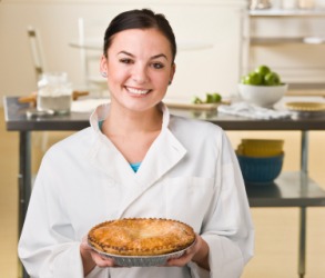 A chef shows an example of a perfect pie. A chef shows an example of a perfect pie.