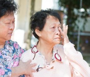 A woman offering her condolences. A woman offering her condolences.