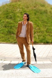 This man's dress might be called eccentric. This man's dress might be called eccentric.